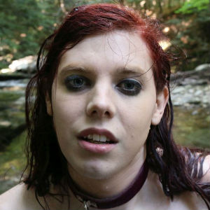 A Close Up Photo of Chelsea Poe, Wet In a River, From The Training of Poe.