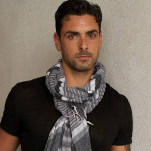 Publicity shot of Ryan Driller being sexy in a kashmir scarf.