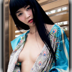 Photo of Marica Hase in sexy Japanese gown revealingly opened.